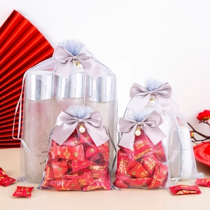 Gray organza gift bags with bow and pearl pendants for jewelry or candy packaging