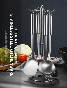 Polished stainless steel kitchen tool set with spatula, ladle, and vertical organizer stand