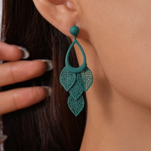 Macro shot of dark green matte leaf earrings with hollow water drop fringe design