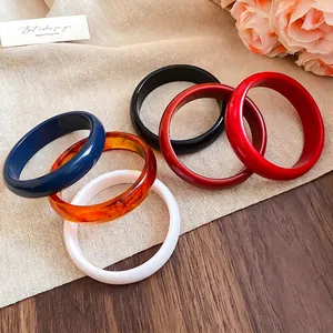 Minimalist geometric resin bangles in multiple colors with high-gloss polished finish