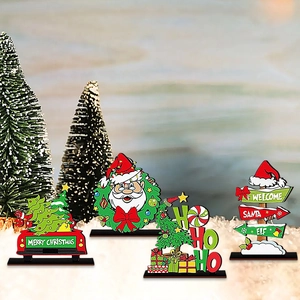 Set of four festive wooden Christmas tabletop ornaments including Santa and tree signs