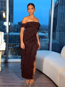 Detail of dark brown off-shoulder evening dress with layered ruffles and high side slit