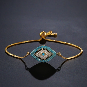 Detailed view of evil eye bracelet with gold plating and sparkling zircon stones