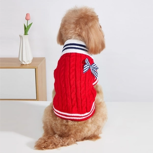 Classic red cable knit dog sweater with blue bow and stripe details for small pets