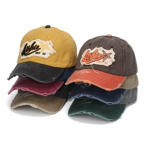 Multiple colors of vintage washed baseball caps with Athlete SINCE 98 embroidery details