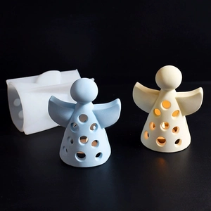Detail of hollow angel candle holder silicone mold with finished plaster light ornaments