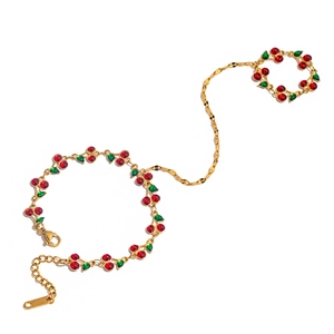 Elegant gold cherry hand chain bracelet with rings and red enamel fruit charms