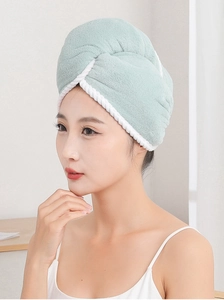 Side view of model wearing thick absorbent microfiber hair drying towel in bean green
