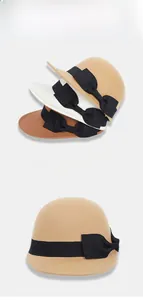 Detail view of felt equestrian hats with elegant ribbon bows in multiple colors