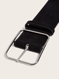 Close-up of matte black suede belt with square silver polished metal buckle detail