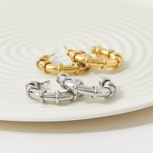 Minimalist C-shaped bamboo knot earrings in polished gold and silver stainless steel