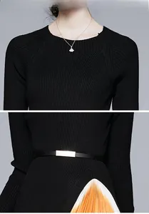 Vue détaillée du corsage en tricot avec ceinture et ourlet de jupe plissée orange
