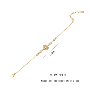 Détail d'un bracelet cœur doré avec pierres, indiquant la taille 16+4cm et le poids 3g