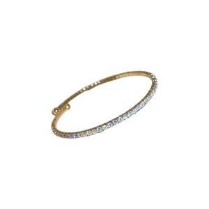 Elegant gold hinged bangle featuring a minimalist row of pavé set white crystals