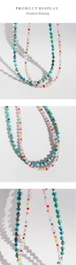 Macro view of rainbow beaded necklace featuring rose quartz and turquoise stone details