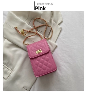 Close-up of pink quilted crossbody phone bag with gold chain strap and turn-lock closure