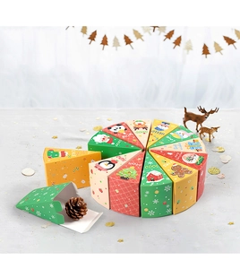 Detail of triangle Christmas gift boxes forming a cake shape with festive cartoon designs