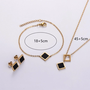 Detailed set view showing 18k gold square earrings, bracelet and necklace set