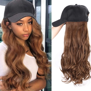 Detail view of black baseball cap wig with long wavy brown hair extensions for women