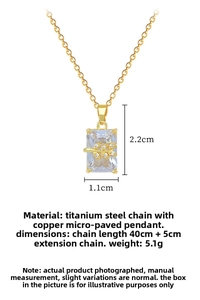 Macro detail of gold leaf rectangular pendant with dimensions 2.2cm x 1.1cm on chain