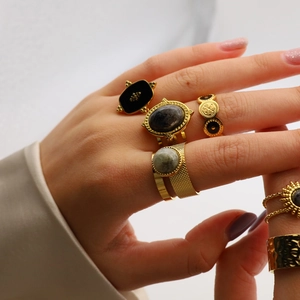 Golden stainless steel adjustable open rings set with natural black stones for women