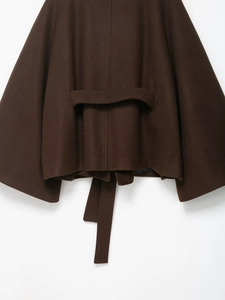 Detail view of the back waist strap and woolen texture on a dark brown coat