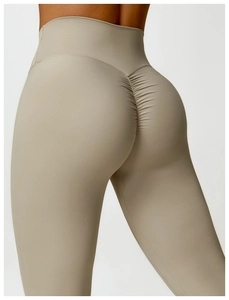 Detail of high waisted scrunch butt yoga leggings in khaki with supportive lifting seams