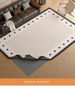 Detail of washable chenille rug with non-slip backing and geometric black patterns