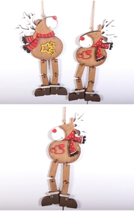 Close-up of wooden reindeer Christmas ornaments with red polka dot scarves and star details