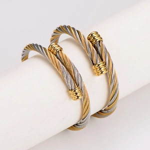 Two-tone stainless steel cable twist open cuff bracelets set with golden round ends