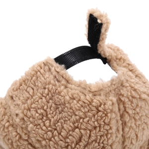 Detail of adjustable velcro strap and plush faux fur texture on the winter baseball cap