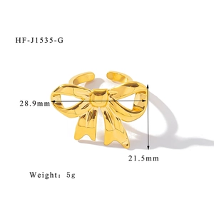 Detailed view of 18K gold butterfly knot ring with dimensions 28.9mm by 21.5mm