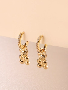 Golden hoop earrings with sparkling stones and cute 3D teddy bear pendant charms