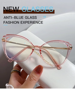 Detail of pink transparent butterfly frame glasses with golden metal temples