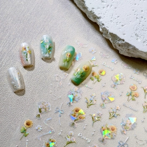 Holographic 3D floral nail stickers featuring sunflowers and daisies for nail art decoration