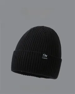 Close-up of ribbed knit texture and woven label on a winter beanie for men