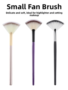 Vertical row of three soft fan makeup brushes in gold purple and black handles