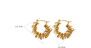Macro shot showing dimensions 2.1cm and 2.9cm of gold spiral U-shaped metal earrings