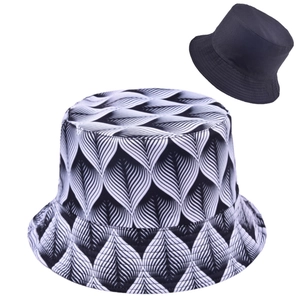 Detail view of double-sided bucket hat with leaf print patterns and solid black cotton fabric