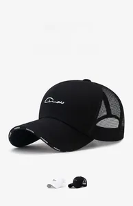 Detail of mesh baseball cap with Fashion lettering on brim and white embroidery