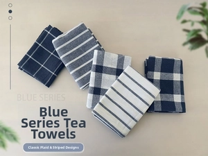 Detailed top view of five blue waffle weave cotton napkins with grid and stripe patterns