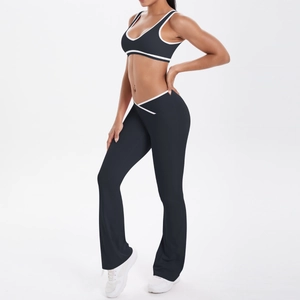 Detail of high-waisted yoga set with V-shaped cross waistband and white contrast piping