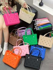 Detailed view of medium-sized EVA beach tote bags in multiple colors with straps