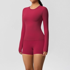 Detail of dark red high-elastic long-sleeve yoga top and matching shorts set