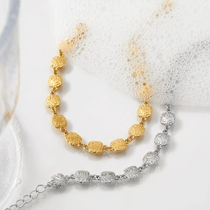 Textured square 316 stainless steel bracelets in gold and silver finish with water droplets
