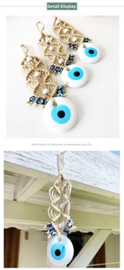 Detail of handmade Turkish evil eye wall hanging with macrame rope and blue glass beads