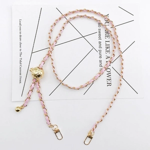 Detail of adjustable gold metal and pink leather crossbody chain for phone cases