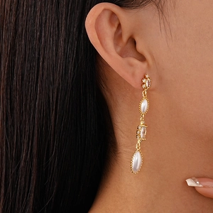 Elegant French vintage gold drop earrings with white pearls and sparkling rhinestones