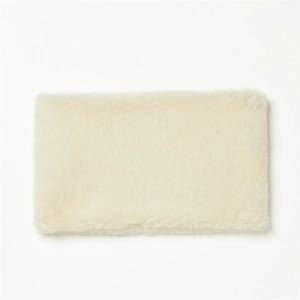 Detail shot of beige faux rabbit fur neck warmer showing soft plush texture and material