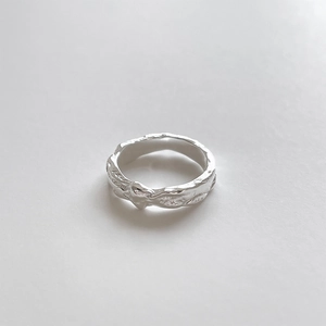 Detailed view of the silver 925 sterling silver ring with organic molten lava texture